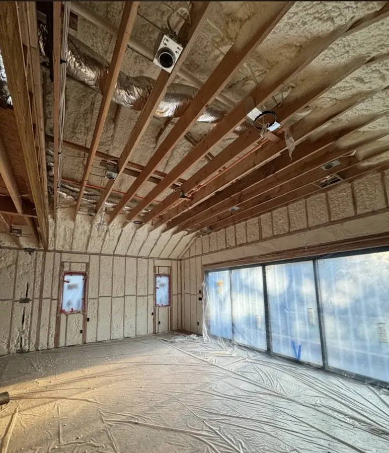 Interior walls and ceiling insulated with spray foam during new construction in West Haven